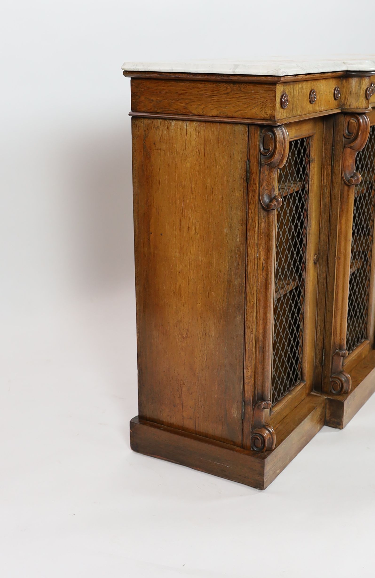 A Victorian rosewood serpentine dwarf bookcase, W.154cm D.44cm H.97cm